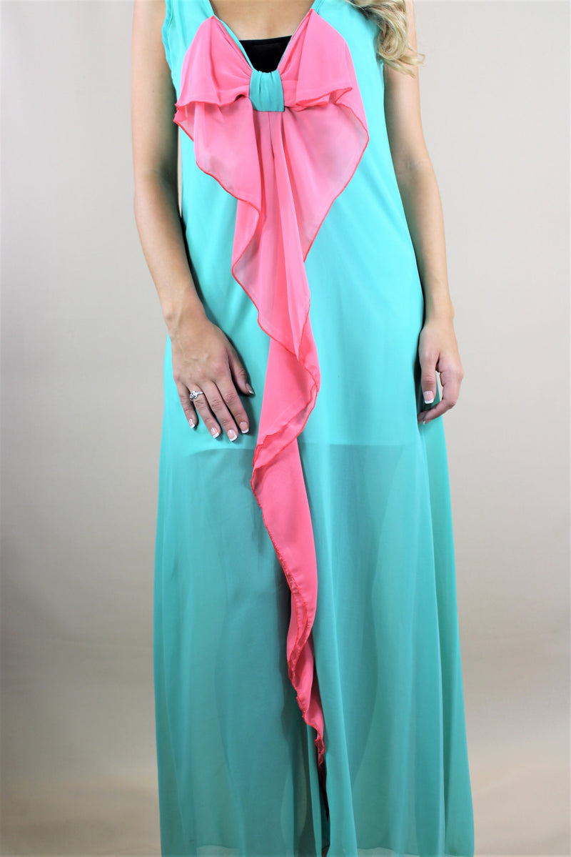 green maxi dress with pink ribbon