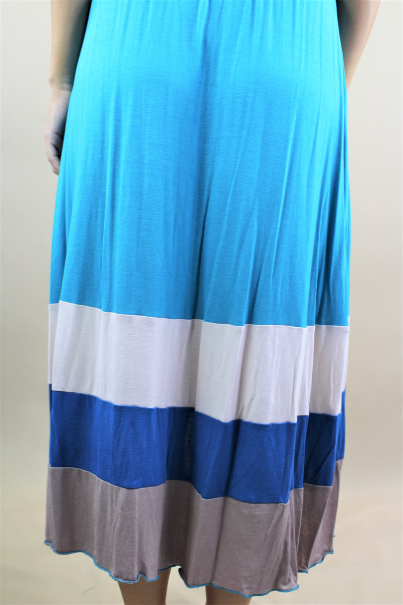 This open back halter dress comes in a blue stripe design and is constructed of 92% rayon and 8% spandex. The flowy design is perfect for your boutique.